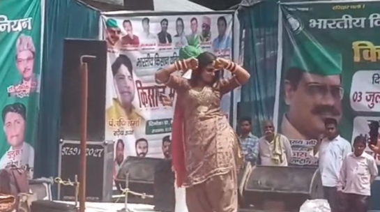 वीआईपी घाट पर किसान सम्मेलन, महिला कलाकार के डांस पर मचा बवाल, गंगा सभा ने जताई आपत्ति